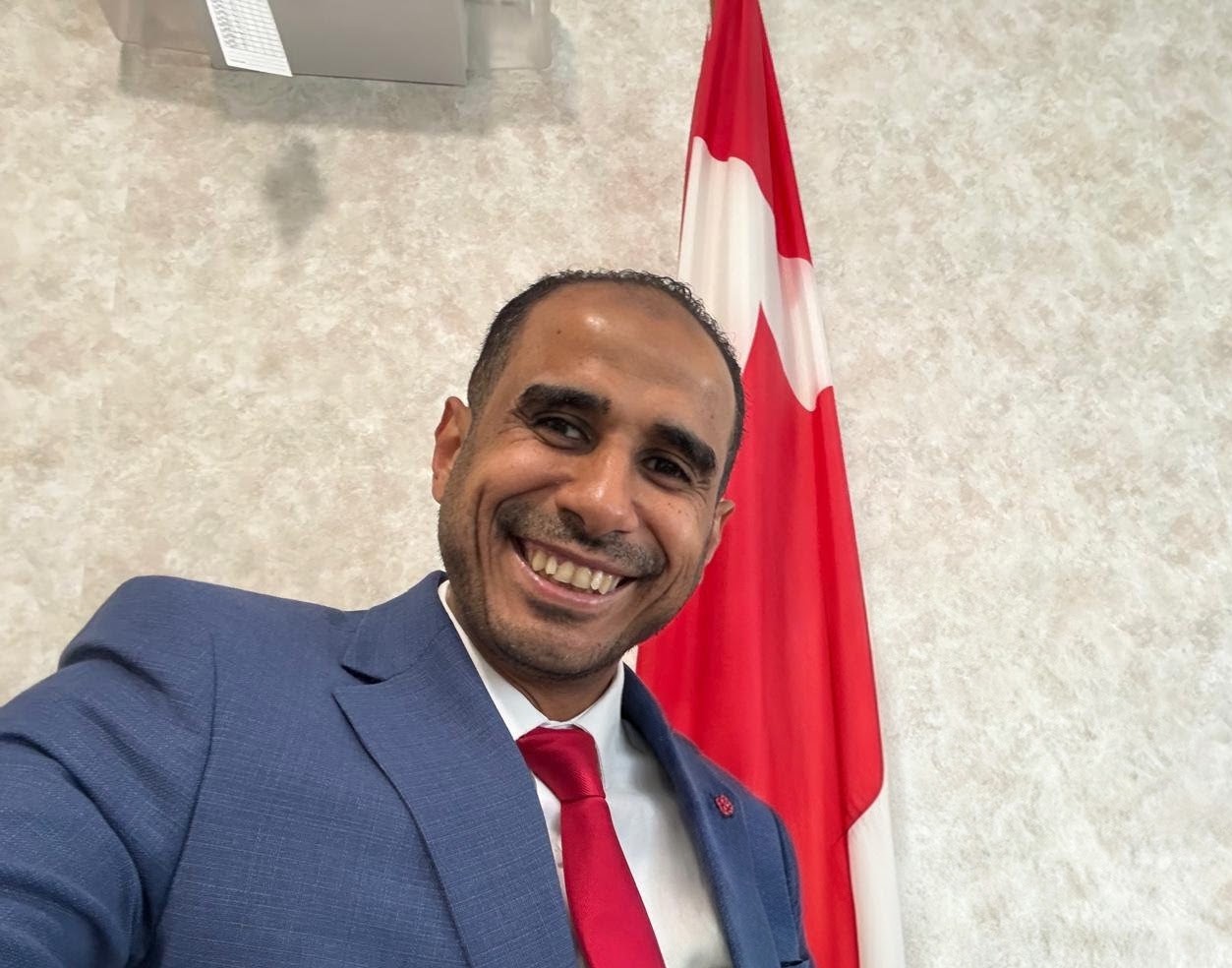 Mohamed Askalany with community members outdoors